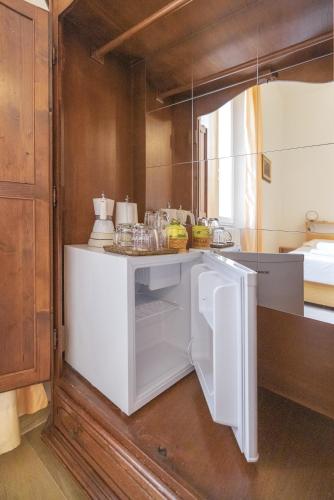 a kitchen with a white counter with food on it at Casaldo's rooms in Florence