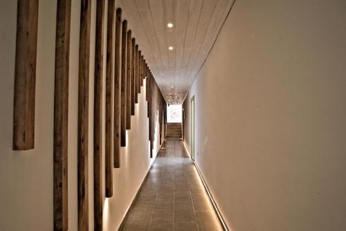 a hallway of a building with a row of paintings on the walls at Stonehillkaş in Kas