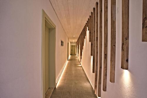 a long hallway with white walls and a white ceiling at Stonehillkaş in Kas