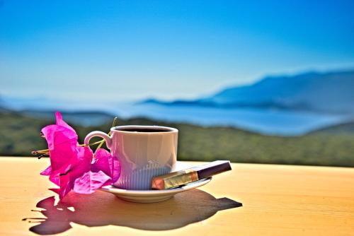 a cup of lipstick and a flower on a table at Stonehillkaş in Kas
