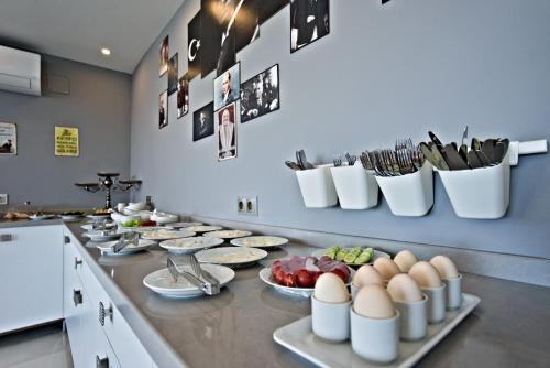 a kitchen counter with eggs and plates of food on it at Stonehillkaş in Kas