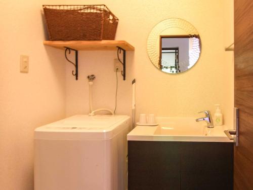 a small bathroom with a sink and a mirror at Kāchibai - Vacation STAY 21657v in Tōzato
