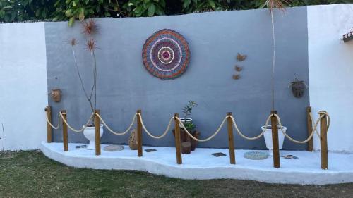 a table with ropes in front of a wall at Pousada Paracuru Surf in Paracuru