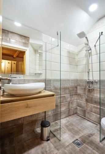 a bathroom with a sink and a shower at Zagorska Bajka in Krapina