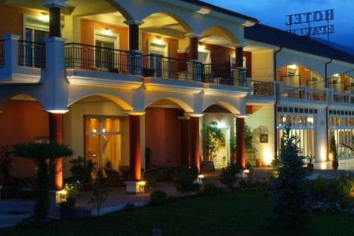 a large building with a balcony on top of it at Hotel Epavlis in Drama