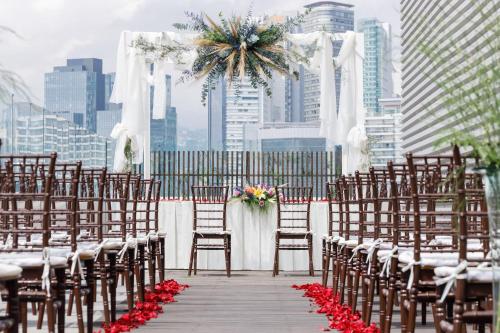 a wedding ceremony with chairs and a altar with flowers at Camino Real Santa Fe in Mexico City