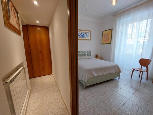 a small bedroom with a bed and a window at C r a zy for RHome in Rome