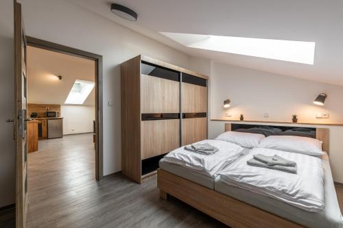 Postel nebo postele na pokoji v ubytování Apartmány Lucie