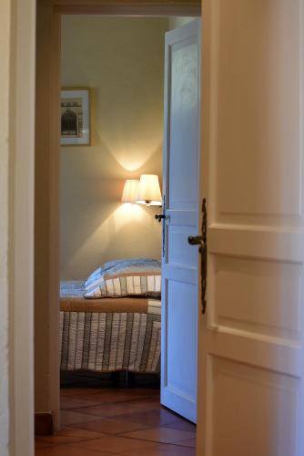 Ein Bett oder Betten in einem Zimmer der Unterkunft Le Mas Soli - Gîtes et Réception