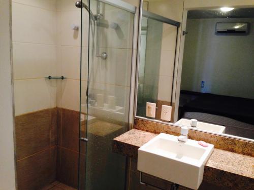 a bathroom with a sink and a shower at Dream Village Cumbuco Beach in Cumbuco