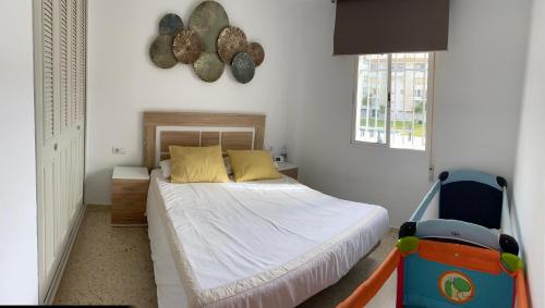 A bed or beds in a room at Beach/Golf