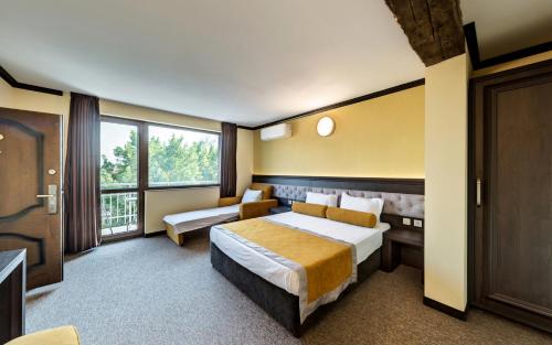 Family Hotel Bunaraにあるベッド