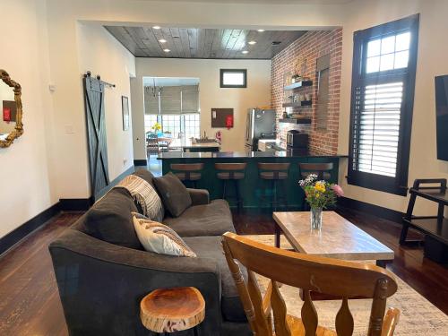 a living room with a couch and a table at Sparkling pool home 6-BR Oasis Near Downtown in San Antonio