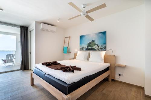 En eller flere senge i et værelse på Chogogo Dive & Beach Resort Bonaire
