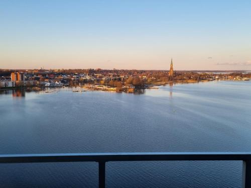 a view of a large body of water at Traumblick! Mitten im Wasser, dem Himmel ganz nah! in Schleswig