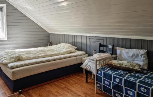Ένα ή περισσότερα κρεβάτια σε δωμάτιο στο 5 Bedroom Lake Front Home In Hornnes