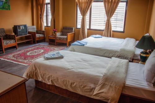 Postel nebo postele na pokoji v ubytování Hotel Metropolitan Kantipur