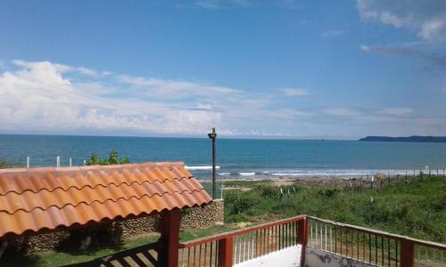 a view of the ocean from a balcony of a house at Phandy in Santa Veronica