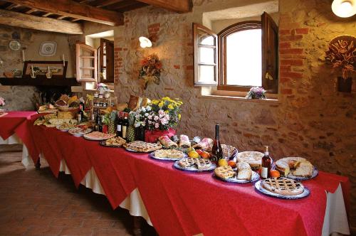 a long table with food on it in a room at Podere Santa Maria in Monte Antico