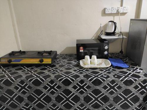 Kuchyň nebo kuchyňský kout v ubytování CiTY Homestay Budget 2bedrooms Midtown Kuala Terengganu