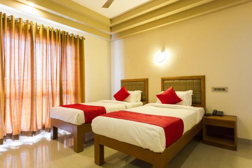 Katil atau katil-katil dalam bilik di Hotel Garden Inn