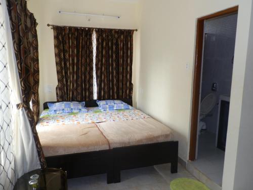 Katil atau katil-katil dalam bilik di Aldrin Guest House