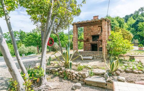a brick house in the middle of some trees at Alloro 3 in Montecarlo