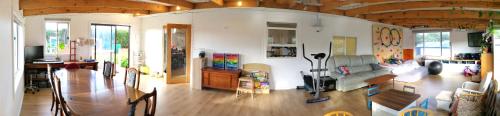 a living room with a couch and a table at Fun Family House King Island in Currie