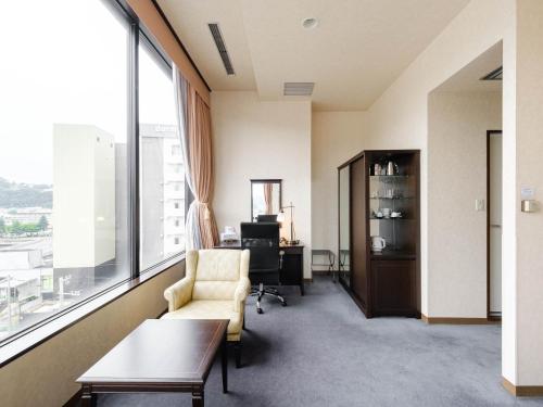 Tabist Abashiri Central Hotelにあるシーティングエリア