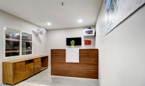 Treebo Grand Milanにあるテレビまたはエンターテインメントセンター
