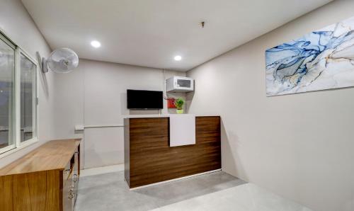 Treebo Grand Milanにあるテレビまたはエンターテインメントセンター