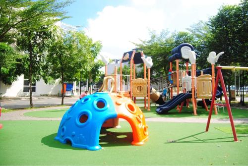 a playground with an elephant and a slide at Nina homestay P1,P4 in Ap My Quo