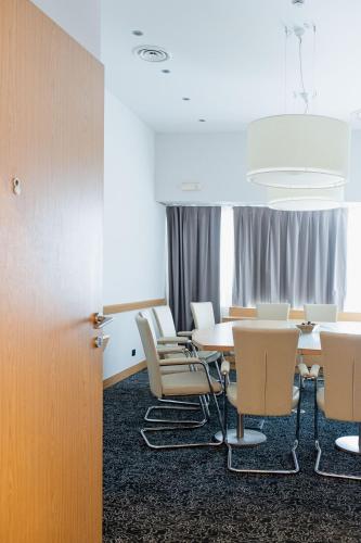 a conference room with a table and chairs at Belstay Milano Assago in Assago