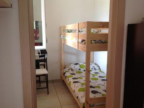 a bedroom with two bunk beds in a room at Holiday Home Bolsena Lake in Grotte di Castro