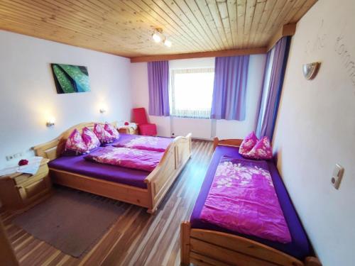 a bedroom with two beds and a window at Chalet in Hippach near Ski Paradise in Hippach