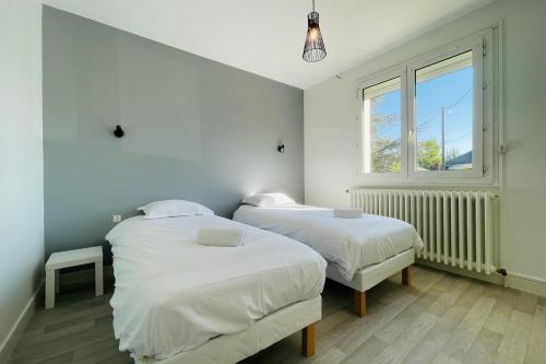 Llit o llits en una habitació de La Marnière - Magnificent house with garden in Chambray-lès-Tours