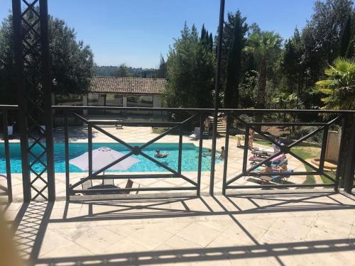 a view of a swimming pool with people in the water at Rome villa swimming pool in Campagnano di Roma