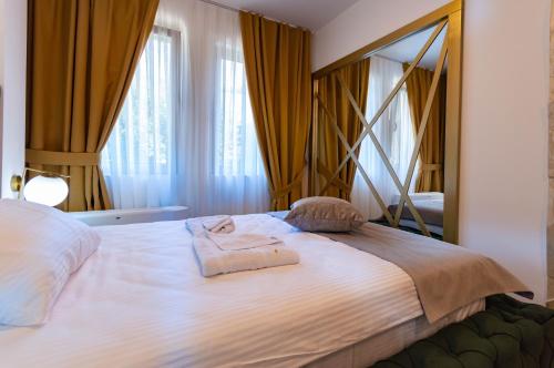 Cama ou camas em um quarto em Hotel IDEAL Deluxe