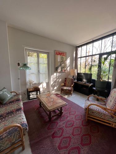 a living room with a couch and a coffee table at La Maison du Gardien in La Rochelle