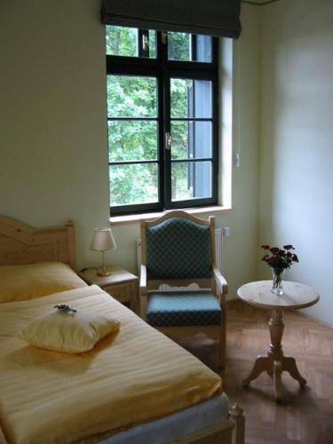 Ein Bett oder Betten in einem Zimmer der Unterkunft Hotel Svatý Tomáš