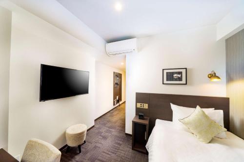 Postel nebo postele na pokoji v ubytování Best Western Hotel Fino Shin-Yokohama