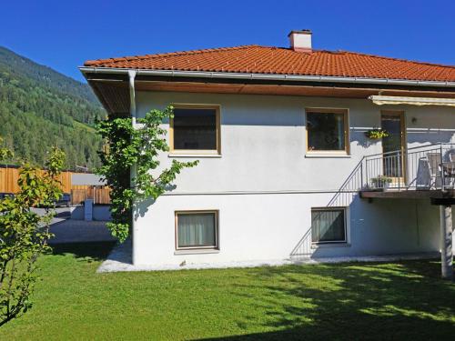 a house with a balcony and a yard at Apartment Christine by Interhome in Prutz