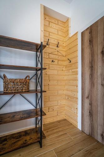 a room with wooden walls and wooden shelves at Good Morning Giewont & JACUZZI in Kościelisko
