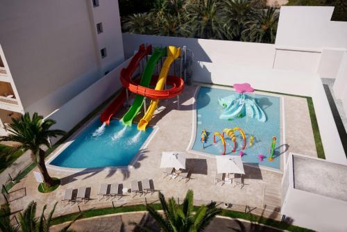 an overhead view of a pool with a water slide at Occidental Sousse Marhaba in Sousse