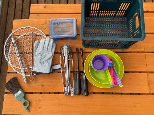 a table with a plate and utensils and a racket at Lanikai kujukuri in Chosei