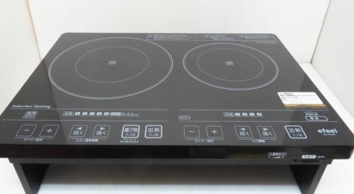 a black radio with four dials on a table at Lanikai kujukuri in Chosei