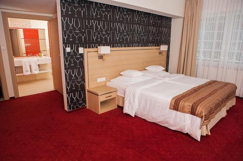 Postel nebo postele na pokoji v ubytování Grape Town Hotel - Park79
