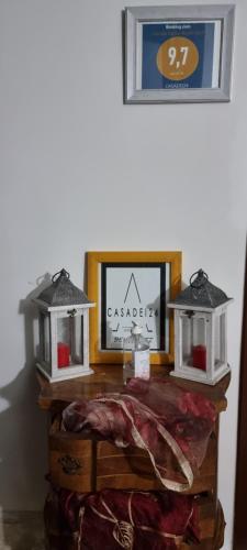 a table with two lights and a mirror on it at CASADEI24 in Guidonia