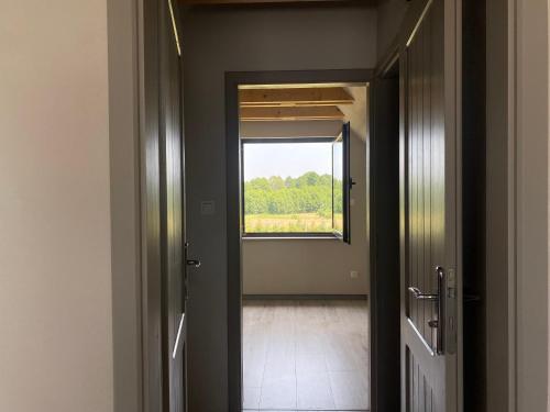 an empty room with a window and a door at Łap chwilę Ostrowo in Ostrowo
