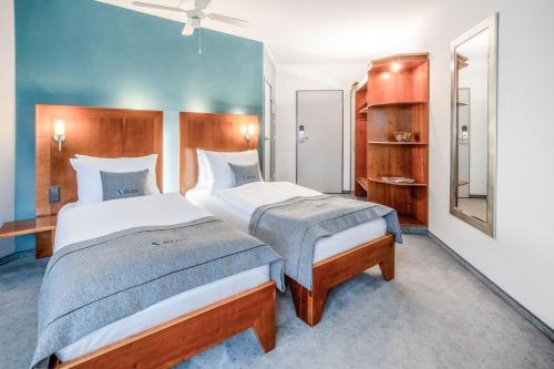 Postel nebo postele na pokoji v ubytování Select Hotel Oberhausen